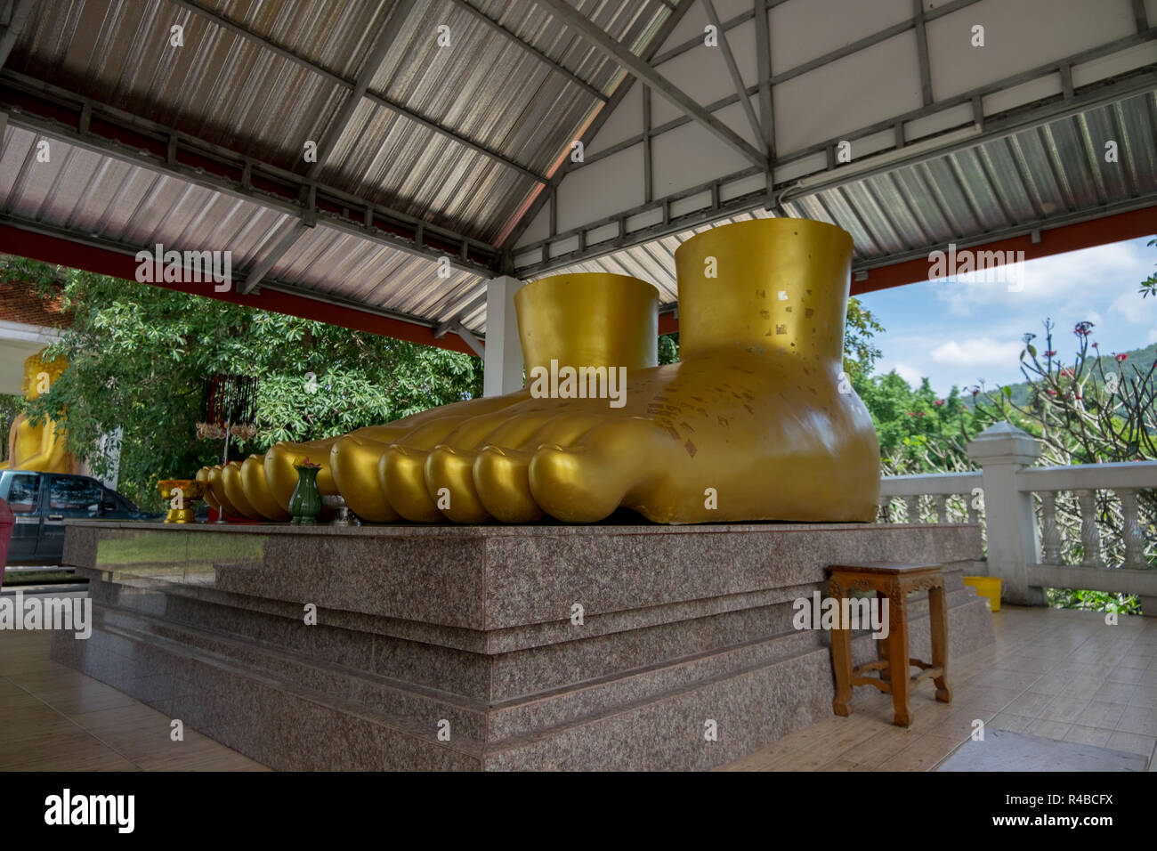 A giant Buddha needs equally giant Buddha golden feet. At the Hat Yai Munincipal Park in Hat Yai, Thailand. Stock Photo