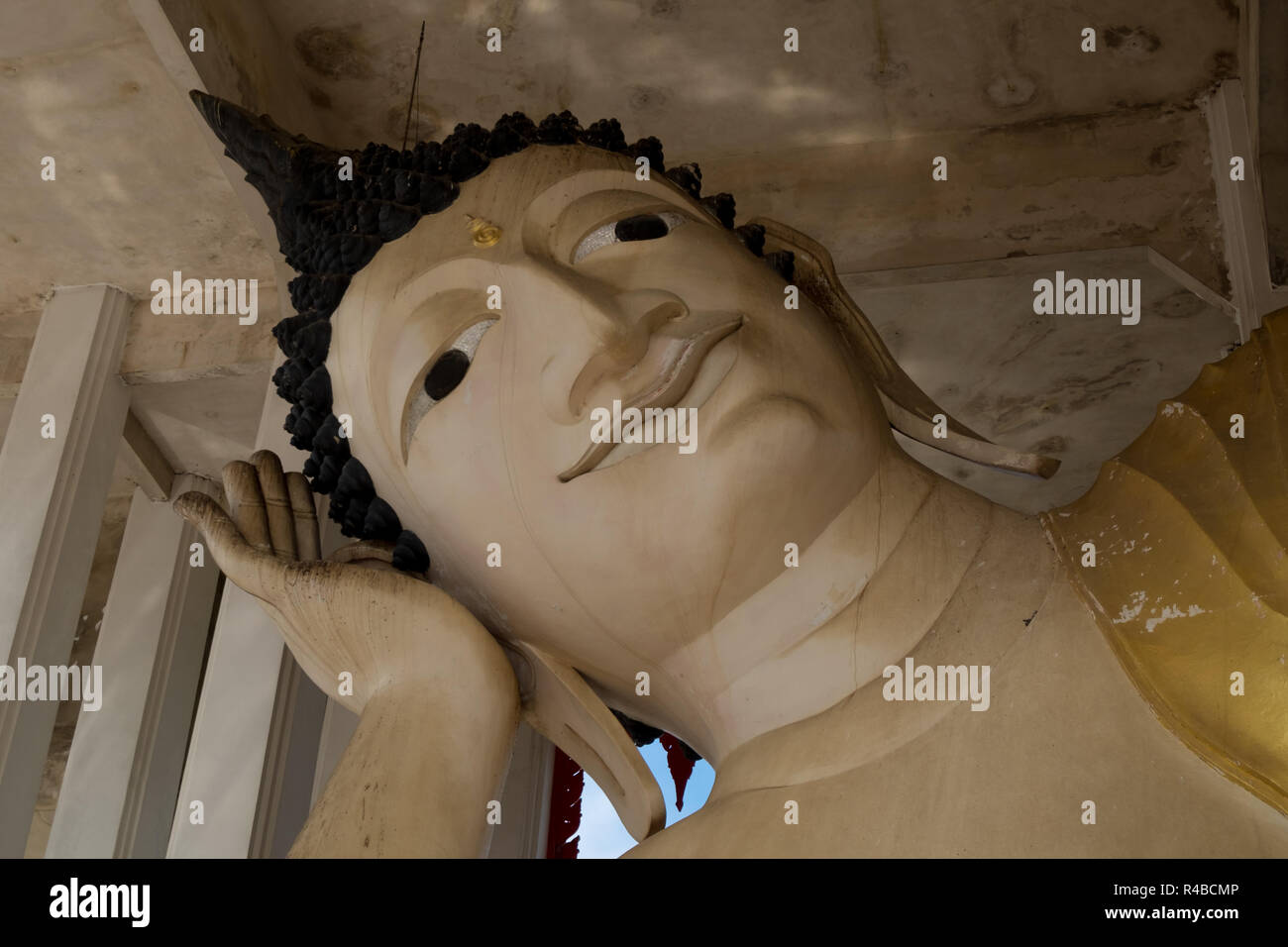 The Reclining Buddha Temple in Hat Yai, Thailand. Inside detail of the big Buddha head. Stock Photo