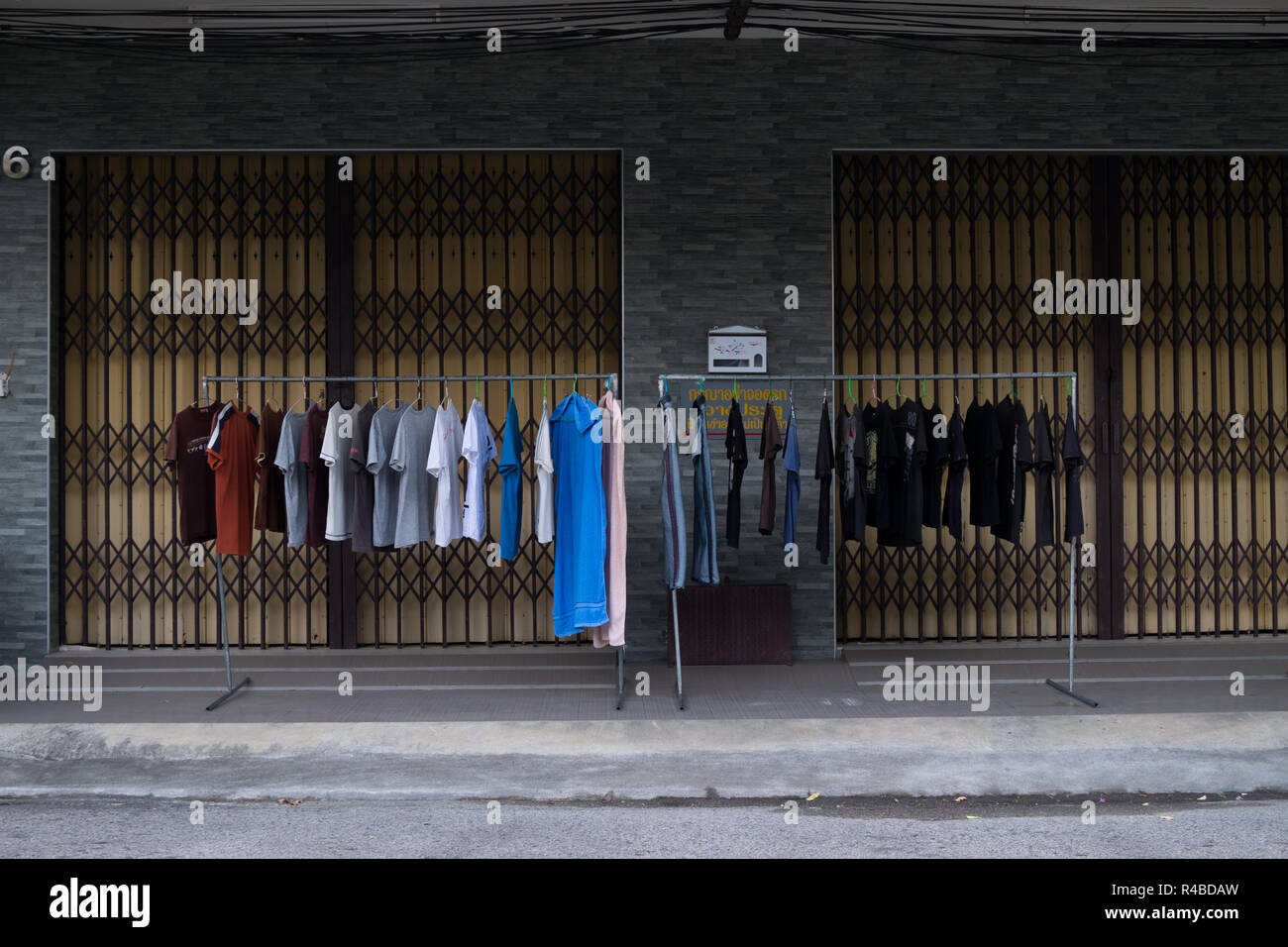 Laundry is carefully set out to dry on racks in Hat Yai, Thailand. Stock Photo