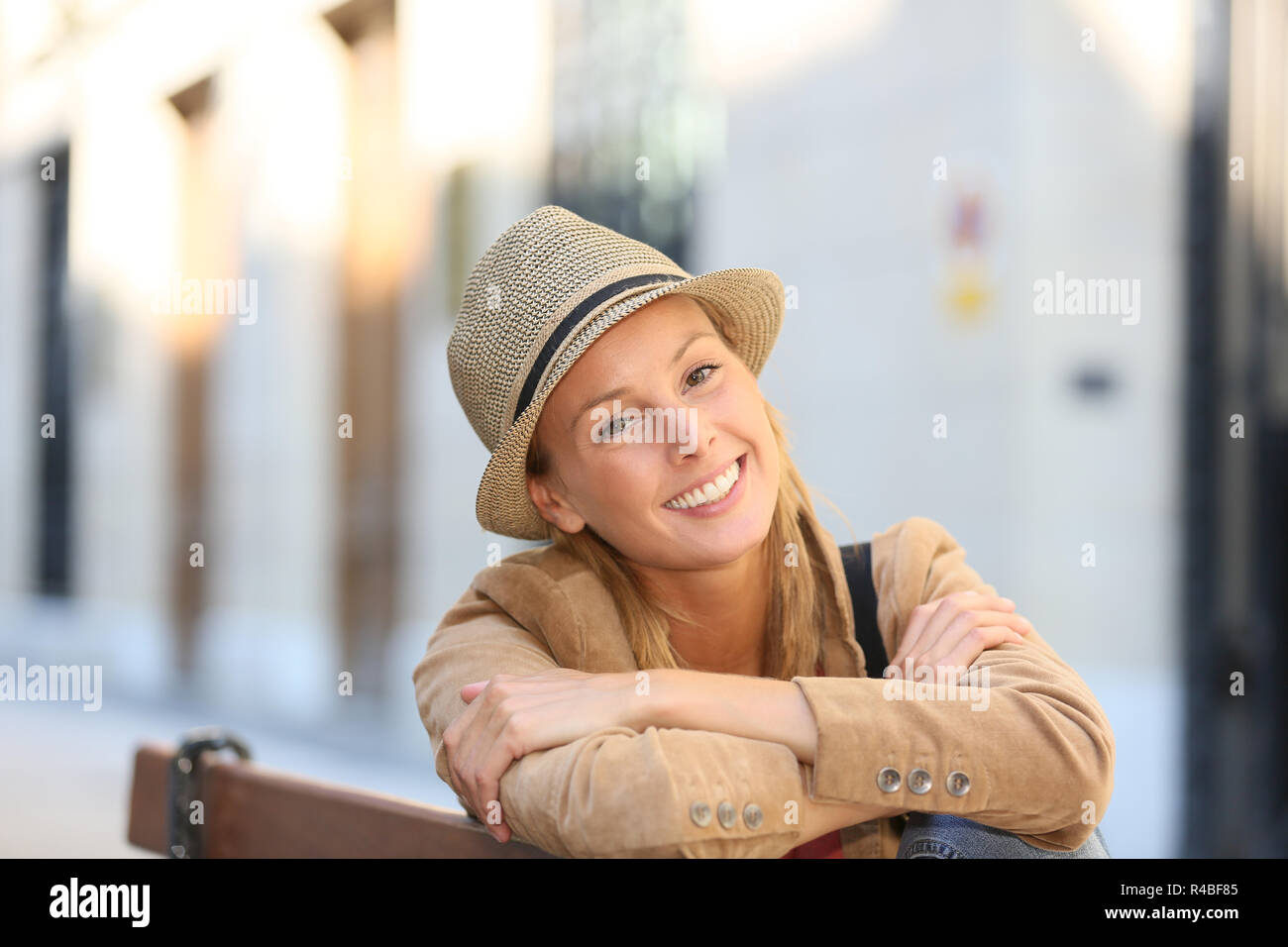 Nice girl sitting on bench hi-res stock photography and images - Alamy