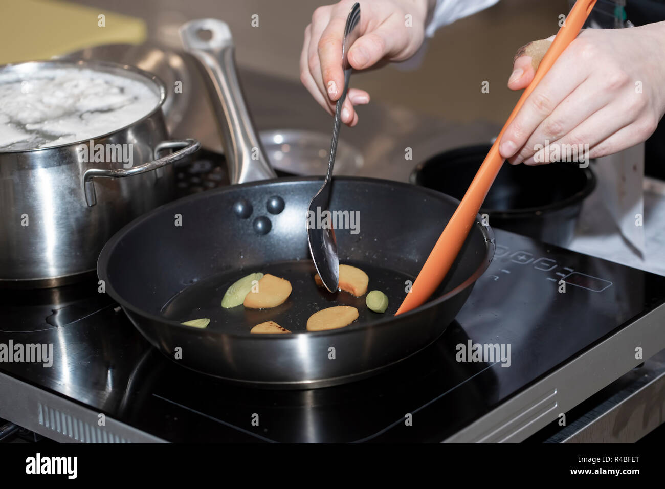 Cooking in a frying pan Stock Photo Alamy