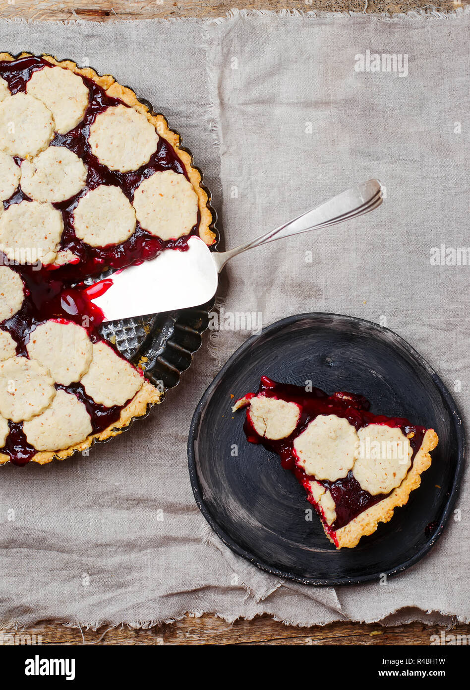 almond tart with cherry. top view. style vintage. selective focus Stock Photo