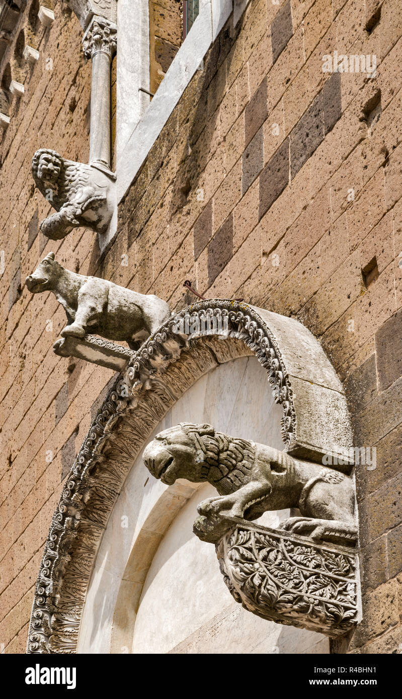 Chimera carvings at facade of Cathedral of St. Michael, 13th century, in hill town of Casertavecchia, Campania, Italy Stock Photo