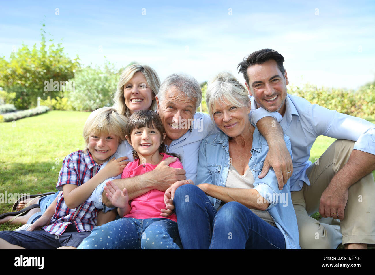 Happy 3 generation family in grandparents' backyard Stock Photo - Alamy