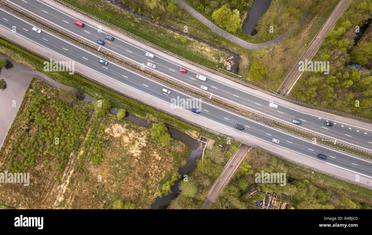 Aerial view of four lane motorway with emergency lane and moderate ...