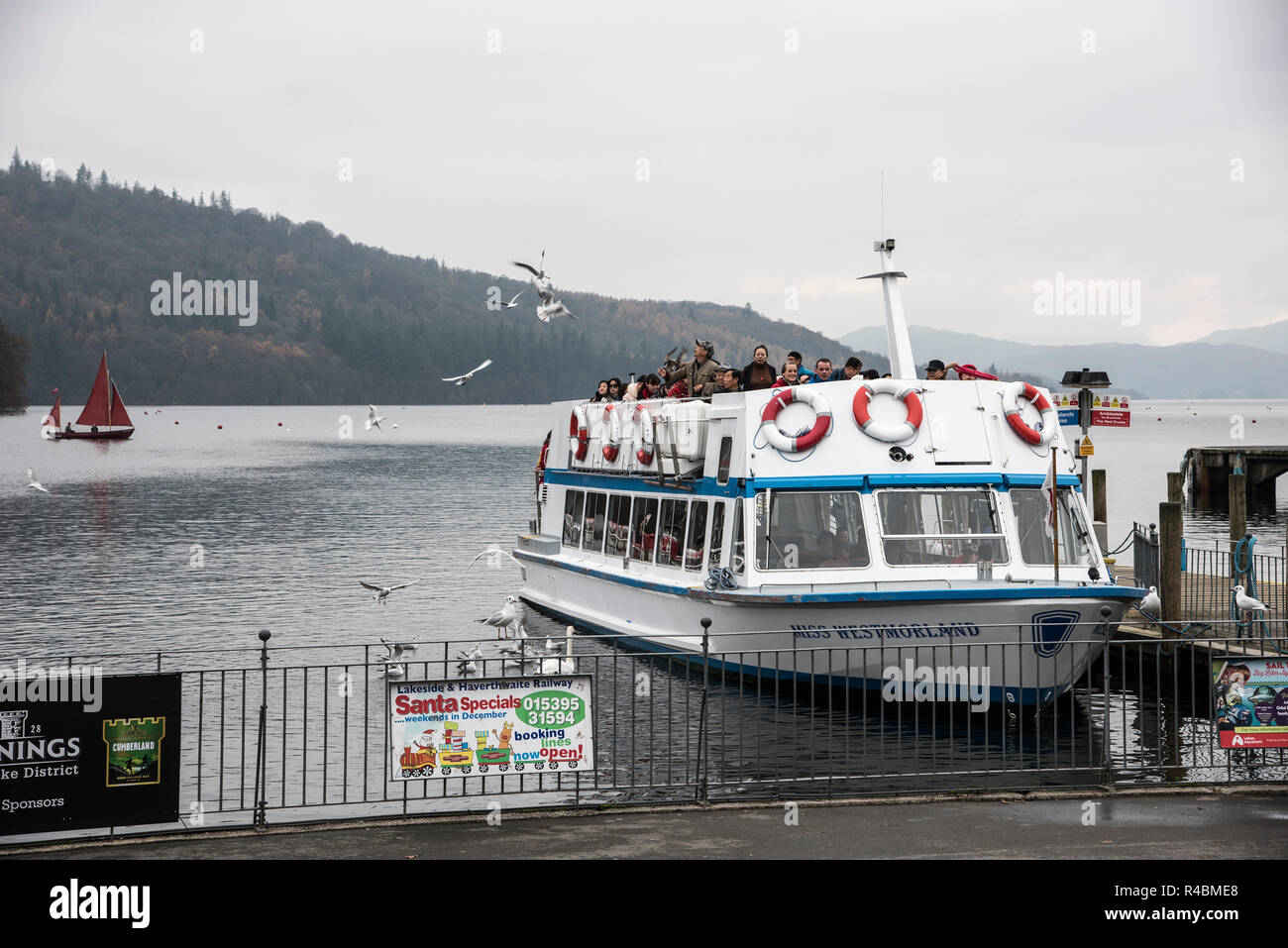 Bowness on Windermere passenger cruise launching from the pier with day