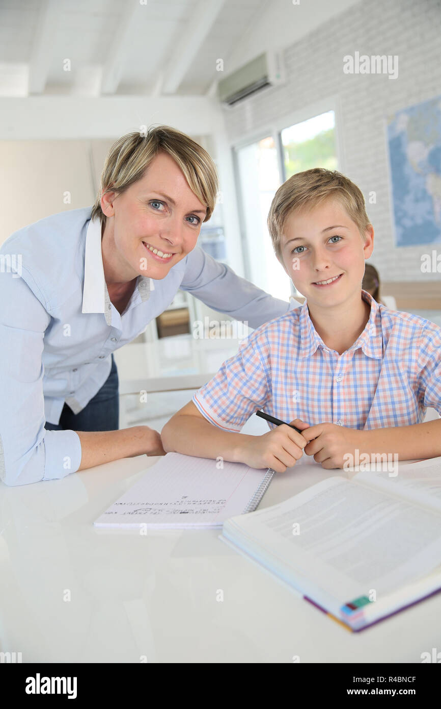 Portrait of smiling teacher with pupil in class Stock Photo - Alamy