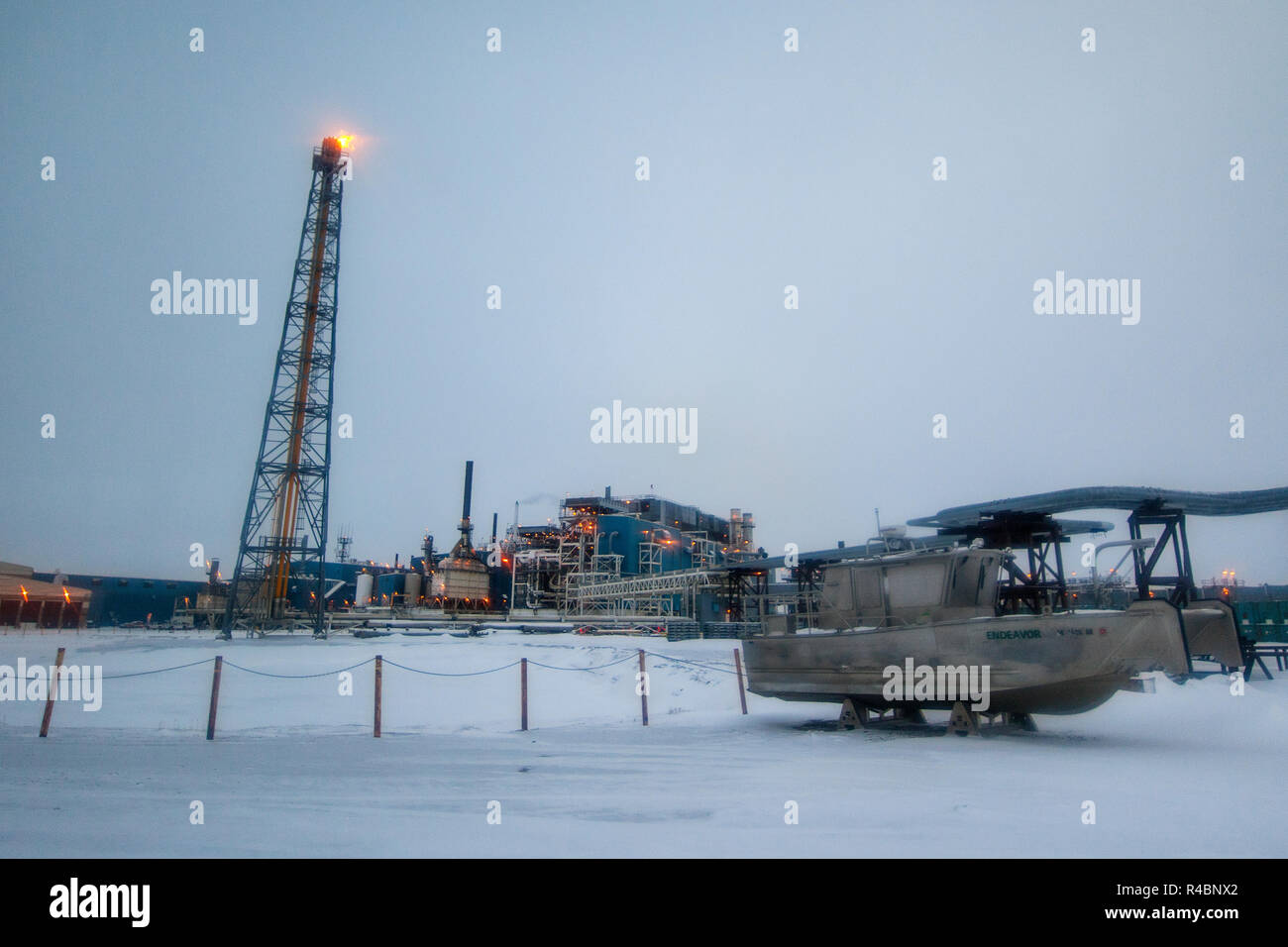 A pilot flame at the oil production facility on the artificial island Endicott outside Prudhoe Bay. Unlike a flaring tower, the pilot flame act as a security measure. Stock Photo