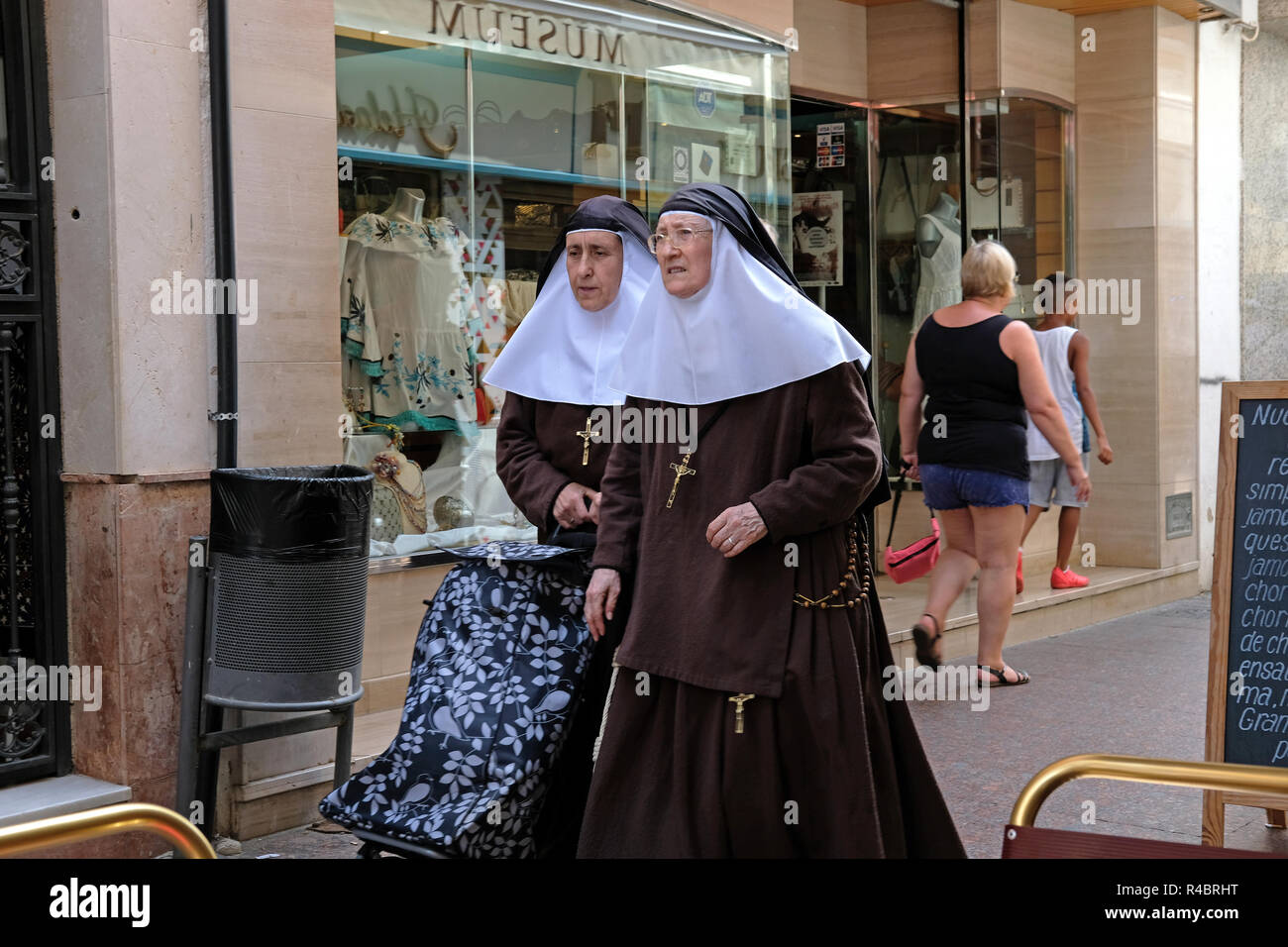 Two nuns walking in Seville. Stock Photo