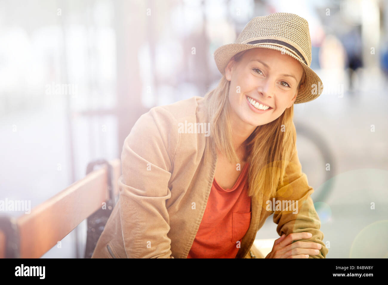 Nice girl sitting on bench hi-res stock photography and images - Alamy