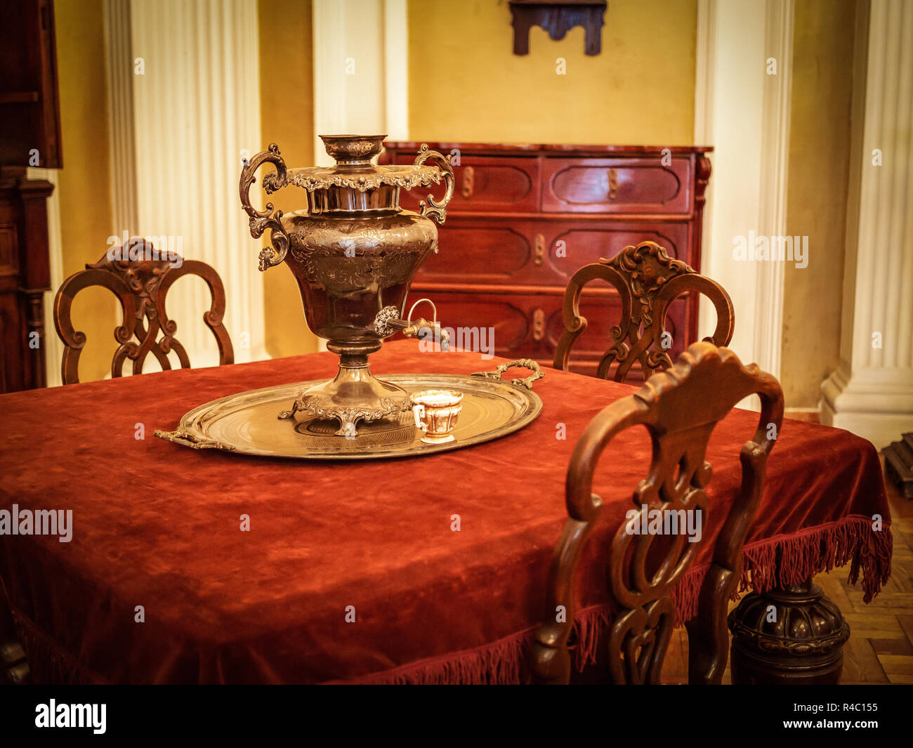 Samovar on the table in the vintage victorian era interior Stock Photo