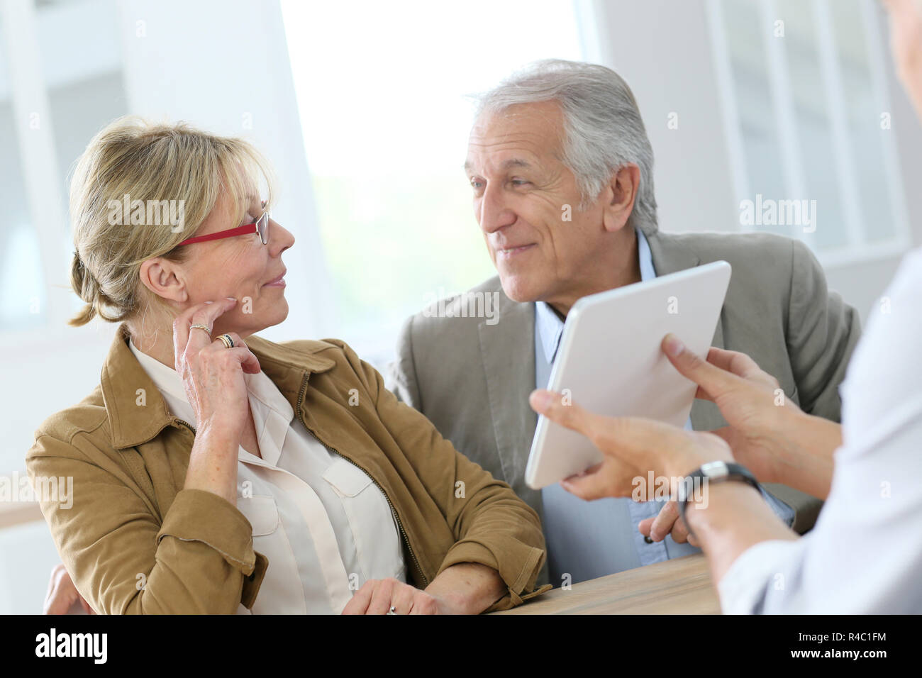 Senior woman at optical store choosing eyeglasses Stock Photo Alamy
