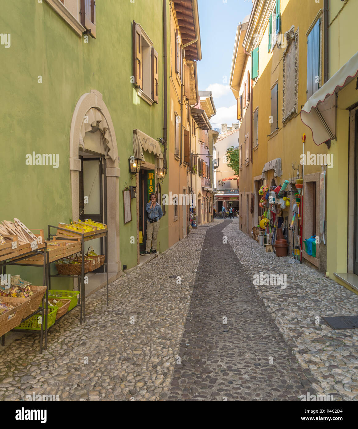 Narrow street in the little medieval village of Malcesine. It is one of the most characteristic towns of Lake Garda in Verona Province, italy Stock Photo
