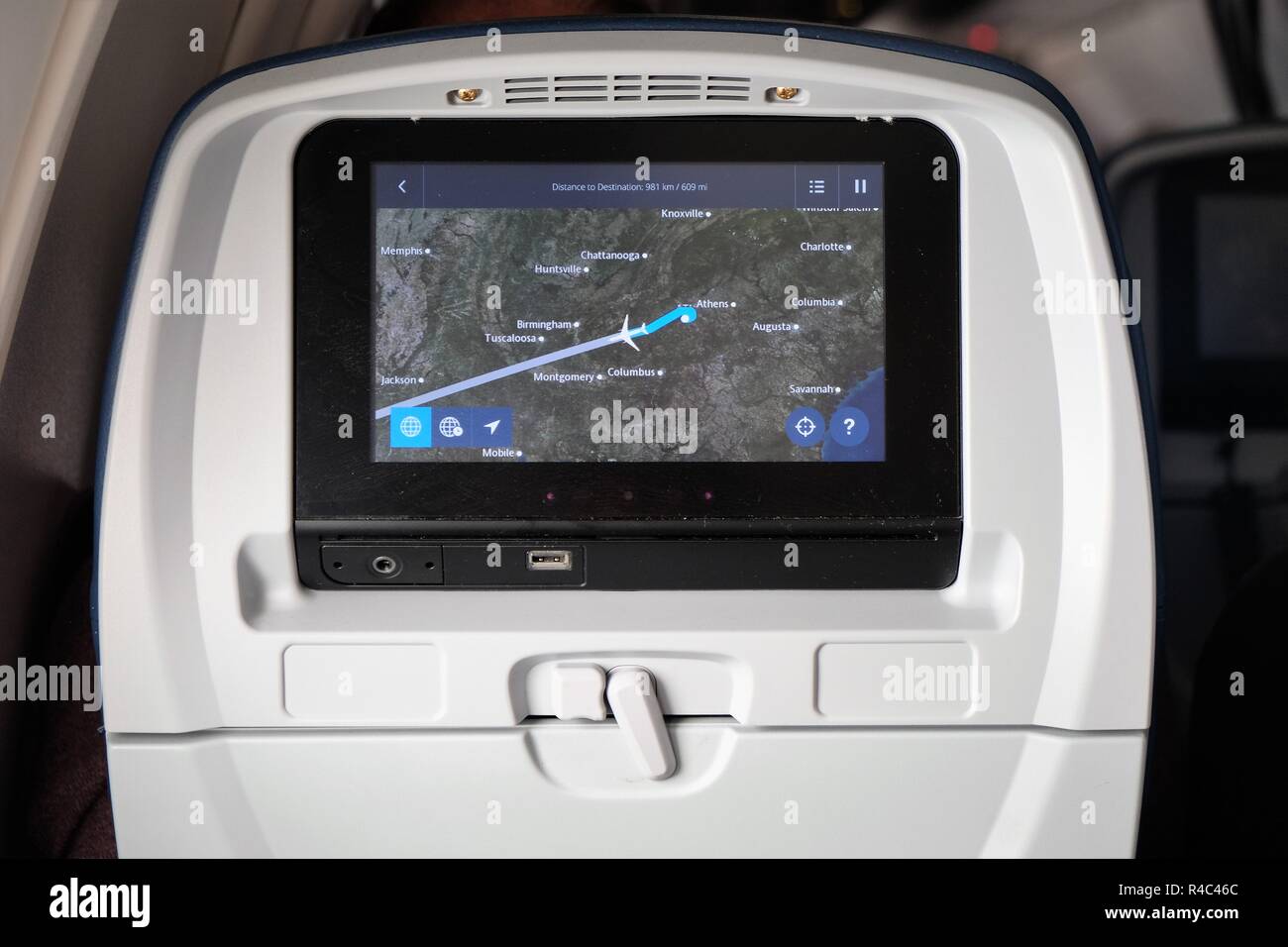 Airplane seat monitor showing a plane flying west across the United State; en route from Atlanta, Georgia to Houston, Texas, USA. Stock Photo