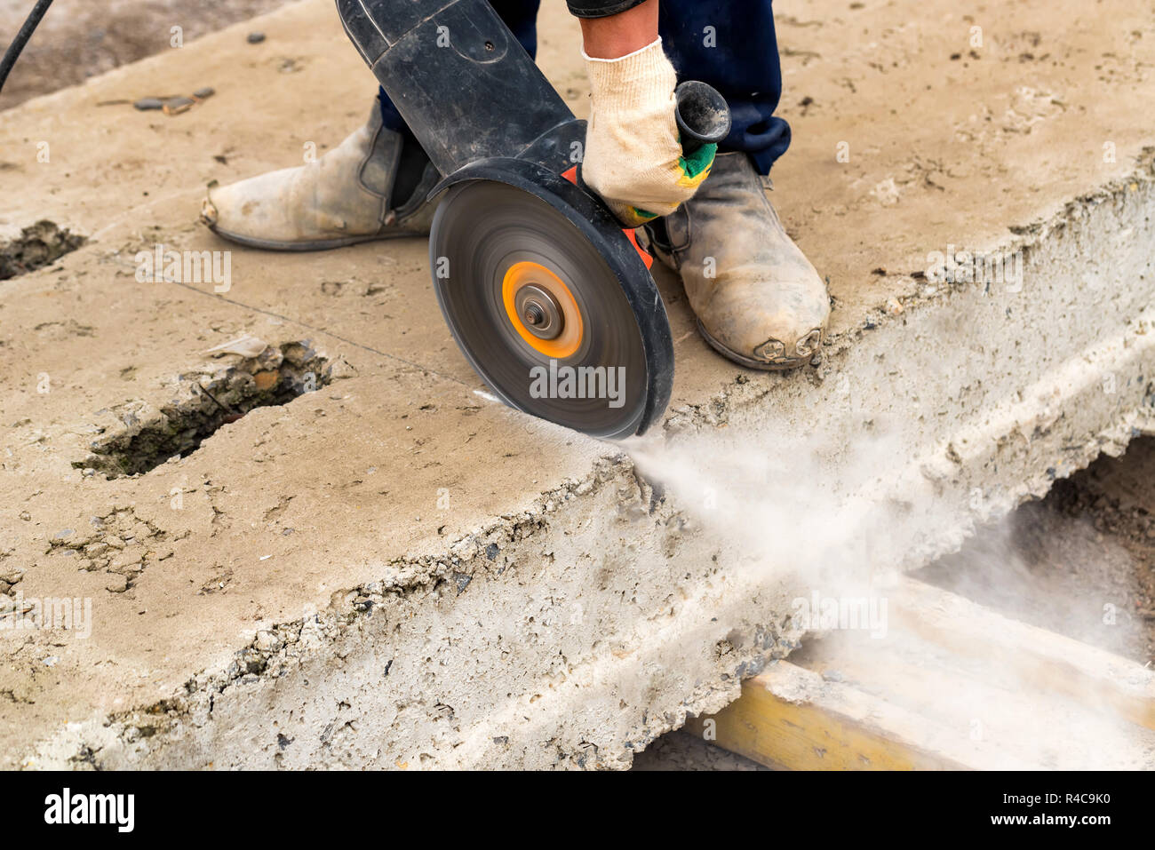 Close up worker cuts concrete with circular saw Stock Photo Alamy