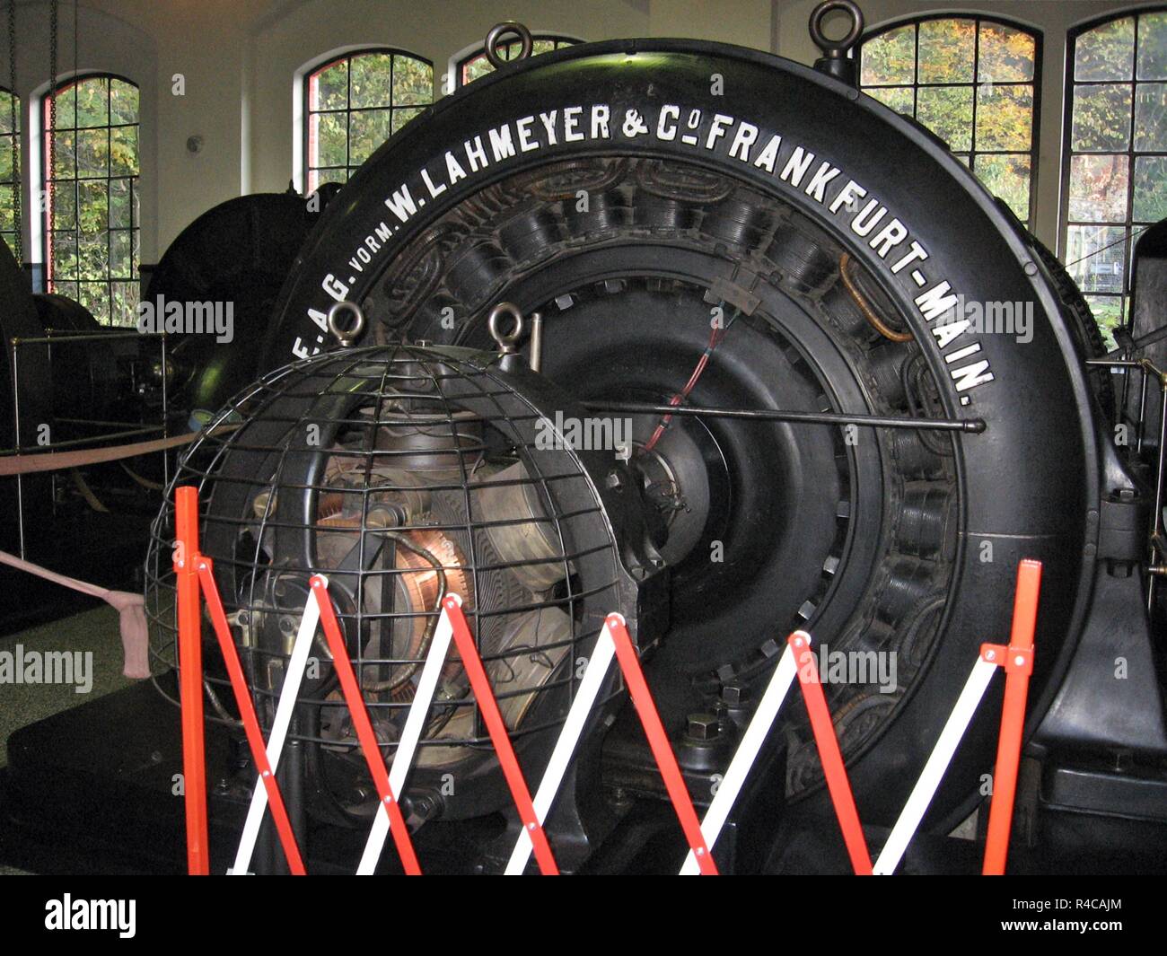 An hydro alternator made by EAG in 1899 in a historic functional hydro power plant. Old German technology Stock Photo