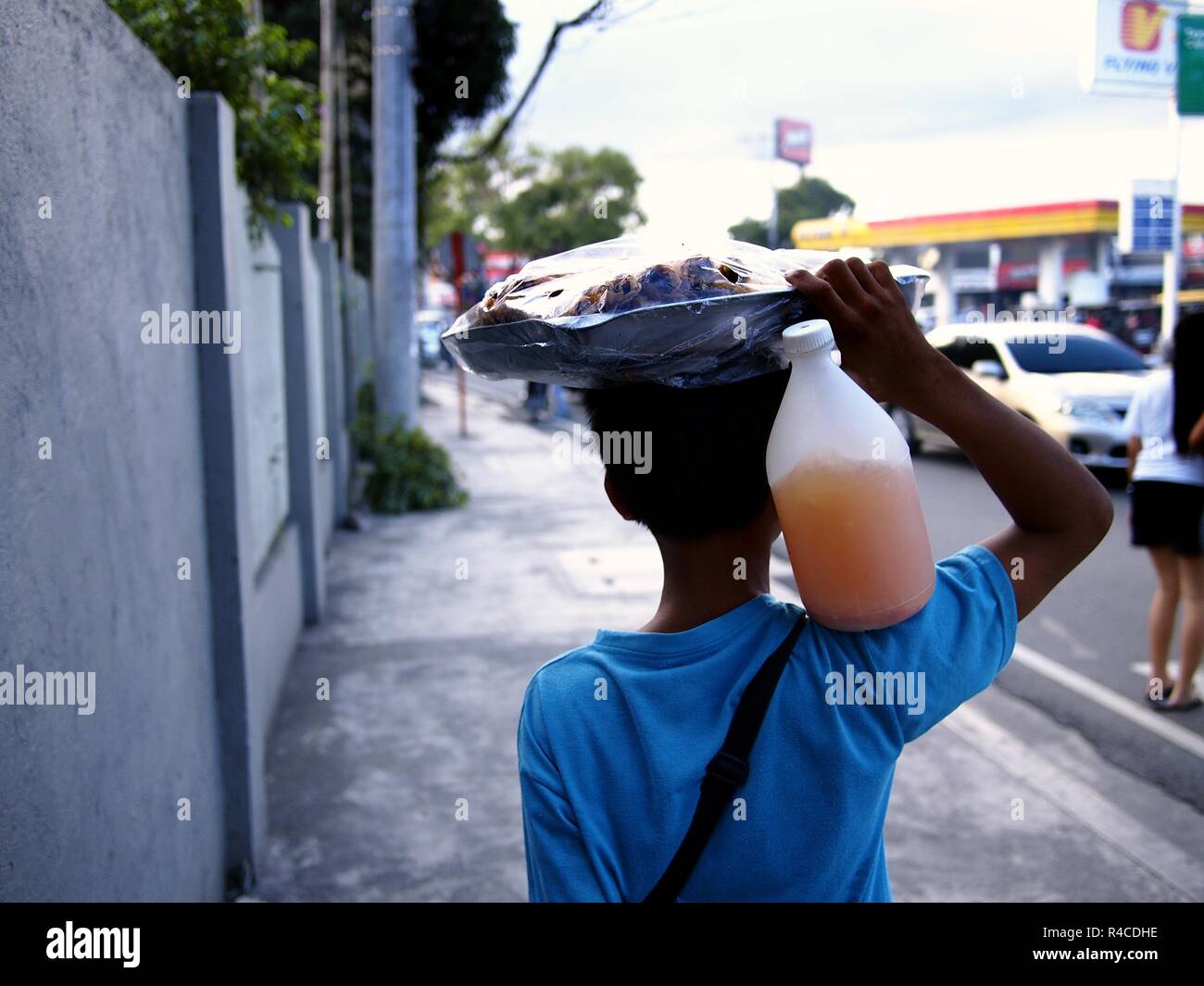 ANTIPOLO CITY, PHILIPPINES - NOVEMBER 24, 2018: A food vendor peddles