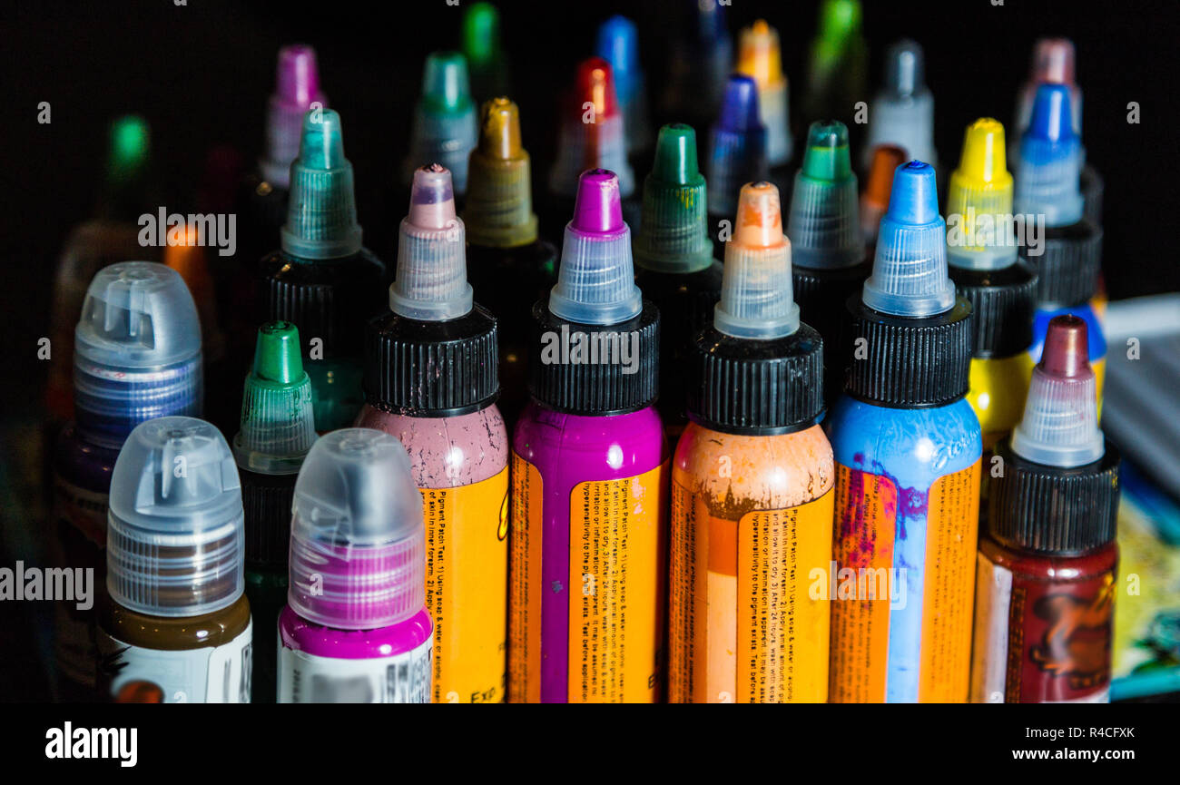 many professional bottles with colored ink for tattoos. tattoo parlor