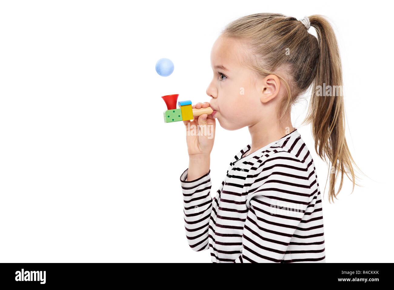 Cute young girl making special exercises at speech therapy office. Child speech therapy concept on white background. Speech impediment corrective exer Stock Photo