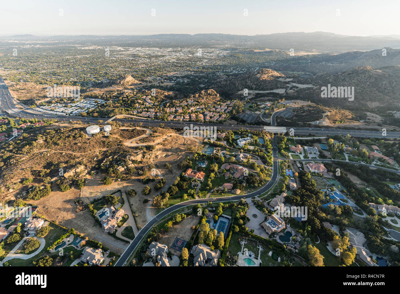 Late afternoon aerial view of homes, estates, mansions and the 118 freeway in the Chatsworth neighborhood of Los Angeles, California. Stock Photo