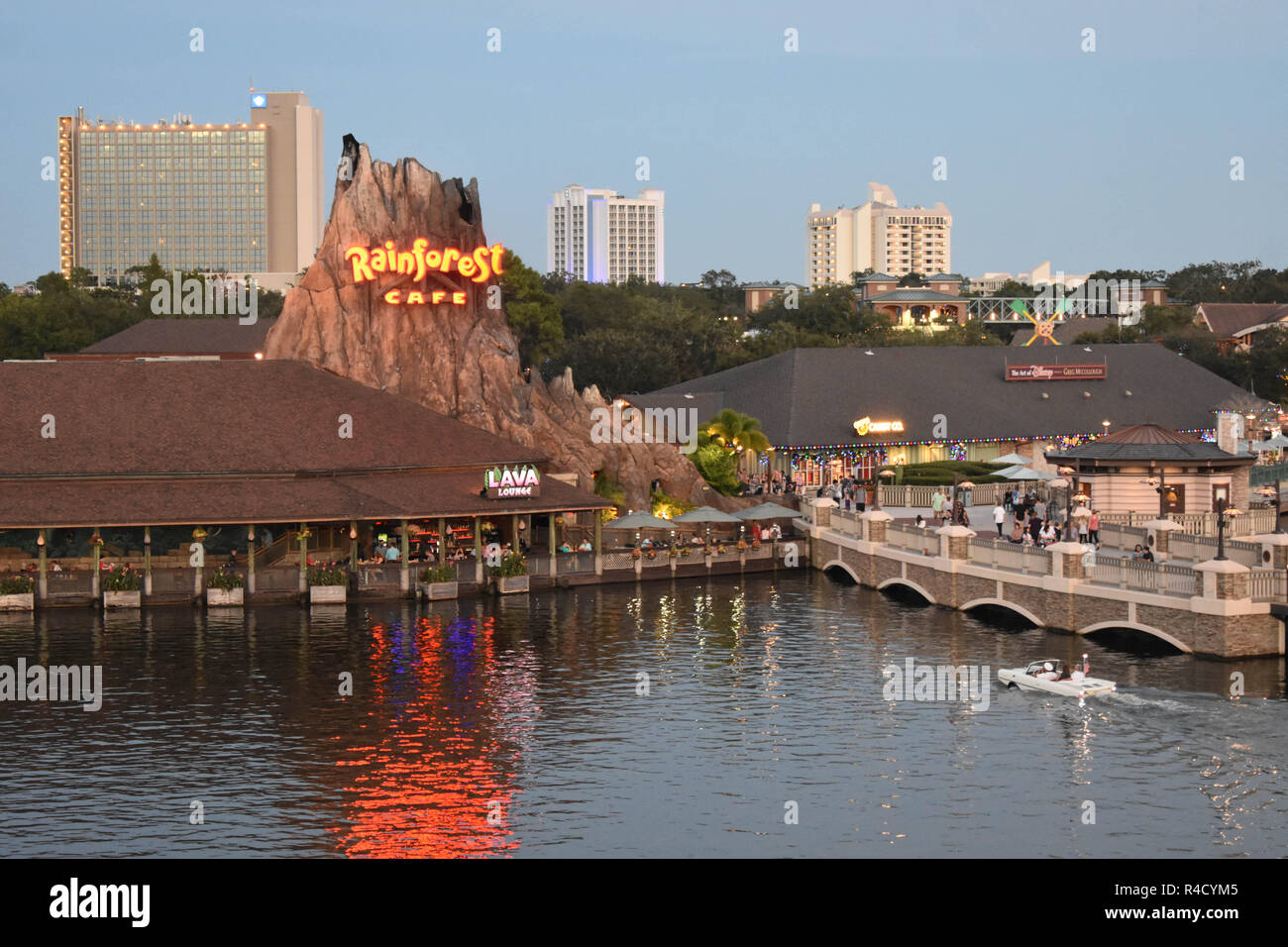 Orlando, Florida.  November 8 , 2018 Beautiful scenery with volcano, lake, bridge and vintage amphibious car on hotel buildings background in Lake Bue Stock Photo