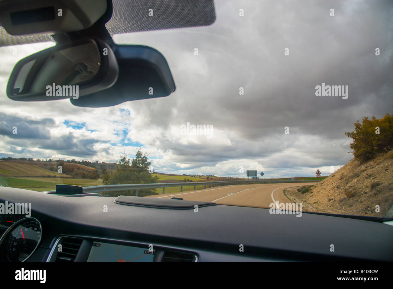 Road viewed from inside a car. Stock Photo