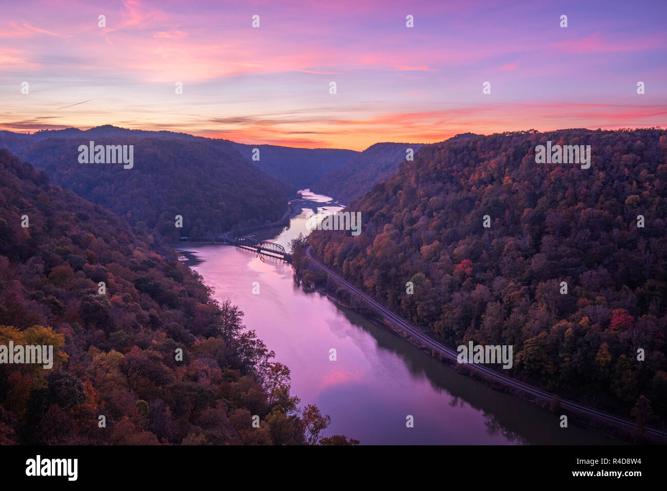 Many shades of pastel colors fill the morning air over the New River and Hawks Nest State Park in West Virginia. Stock Photo