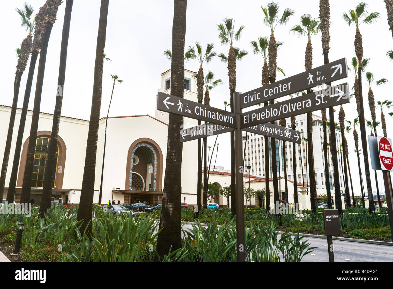 Street signs and in the background is Union Station located in Los Angeles - USA Stock Photo