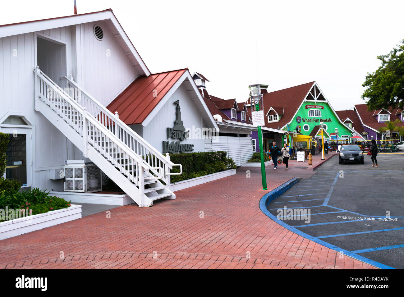 LONG BEACH, CA - FEBRUARY 20, 2017: Shoreline Village is a charming shopping village featuring colorful boardwalk shops and restaurants with Rainbow Harbor view. Stock Photo