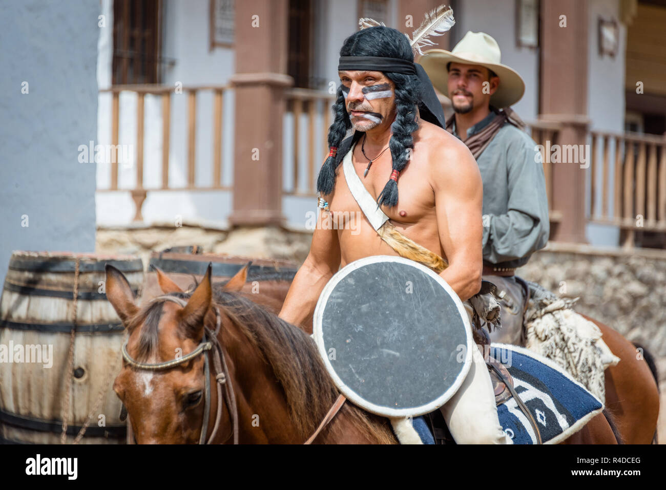 Indian and cowboy ridding horse at Sioux City Park San Augustin, Gran Canaria, Spain Stock Photo