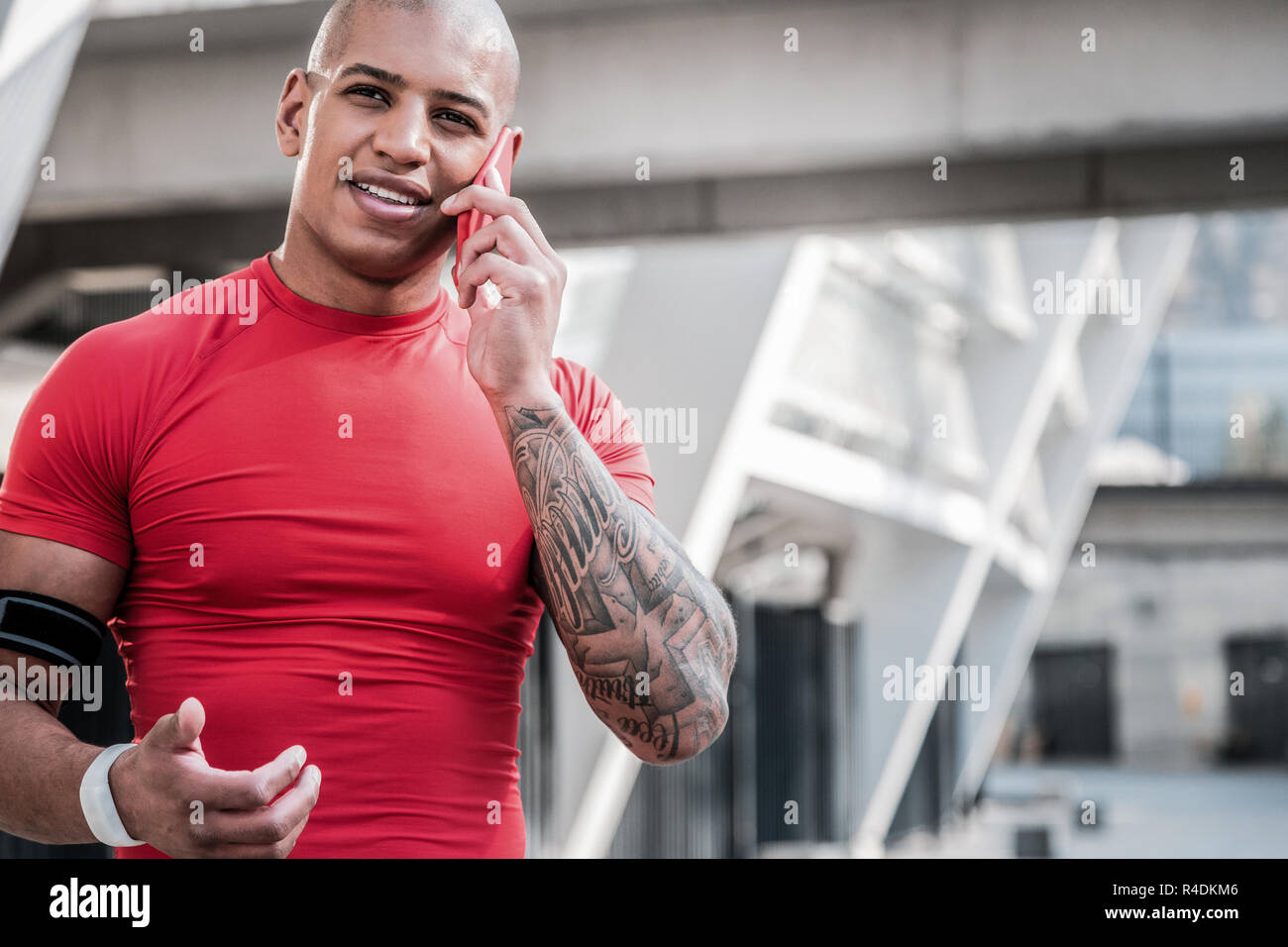 Good looking well built man speaking on the phone Stock Photo