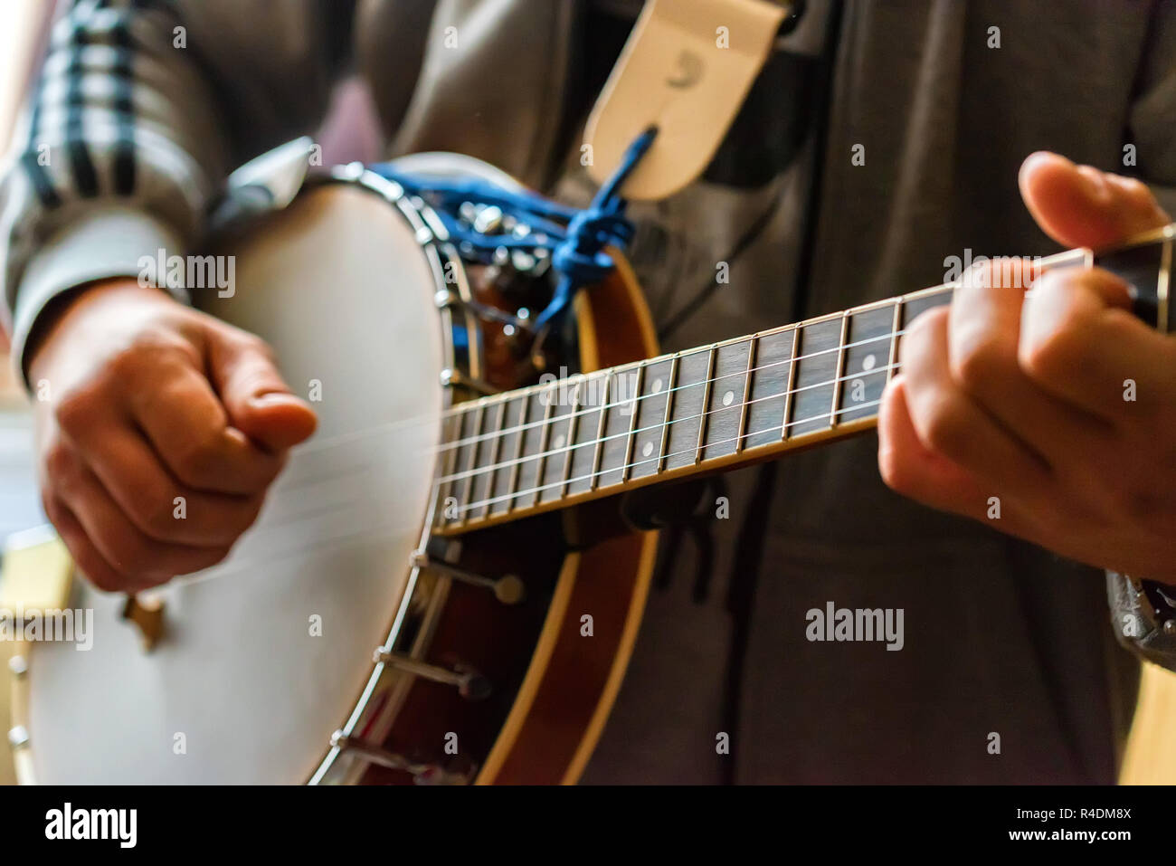 Close up hands of man playing 8string mandolin Stock Photo Alamy