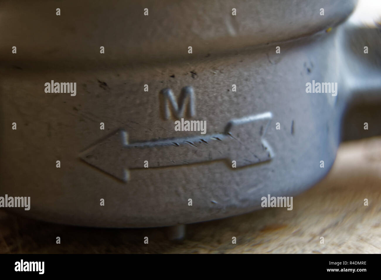 Water meter closeup. Measurement of water flow with direction arrow