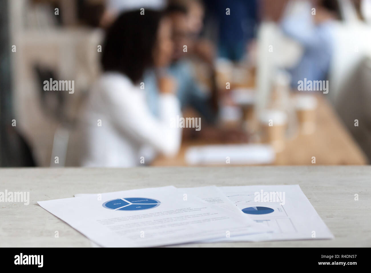 Document with financial report, pie diagram on office table Stock Photo