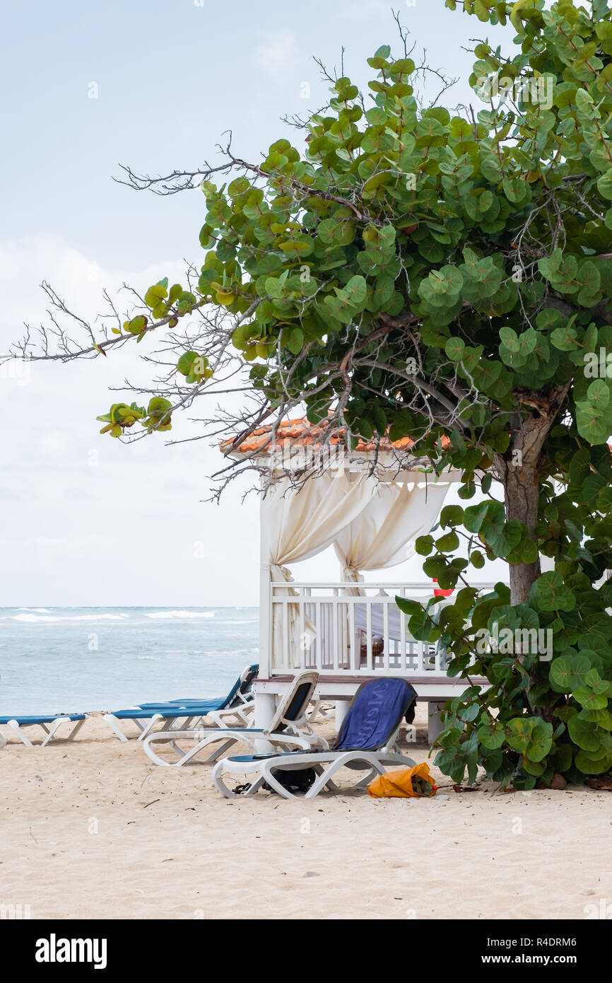 Lounge chairs set up near a gazebo on Playa Jibacoa in Cuba. Stock Photo