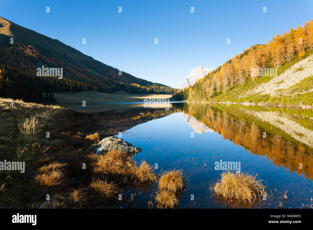 Reflections on water, autumn panorama from mountain lake Stock Photo