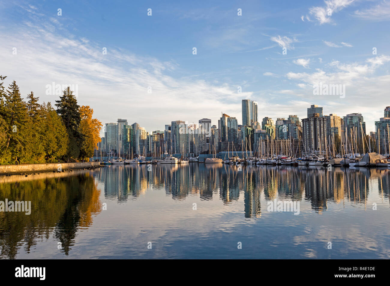 Skyline of Vancouver, British Columbia, with harbor and boats at sunset Stock Photo