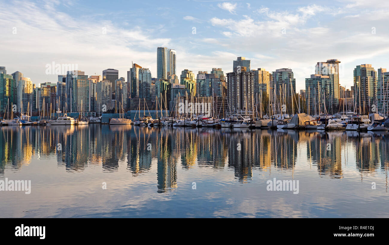 View of Vancouver, British Columbia skyline from the harbor at sunset Stock Photo