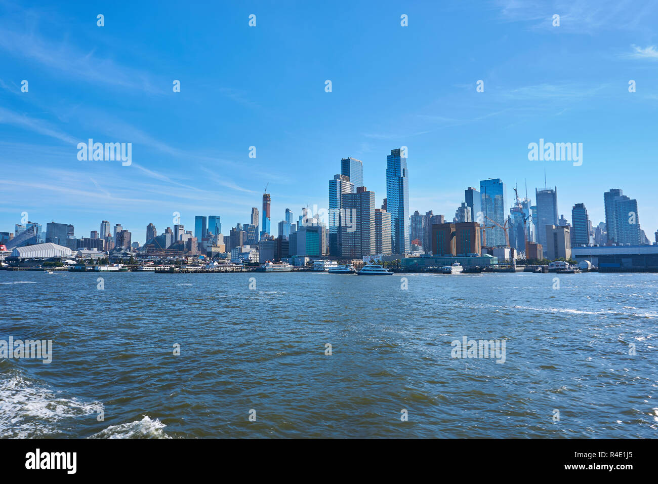 New York City skyline, a blue sky and water Stock Photo - Alamy