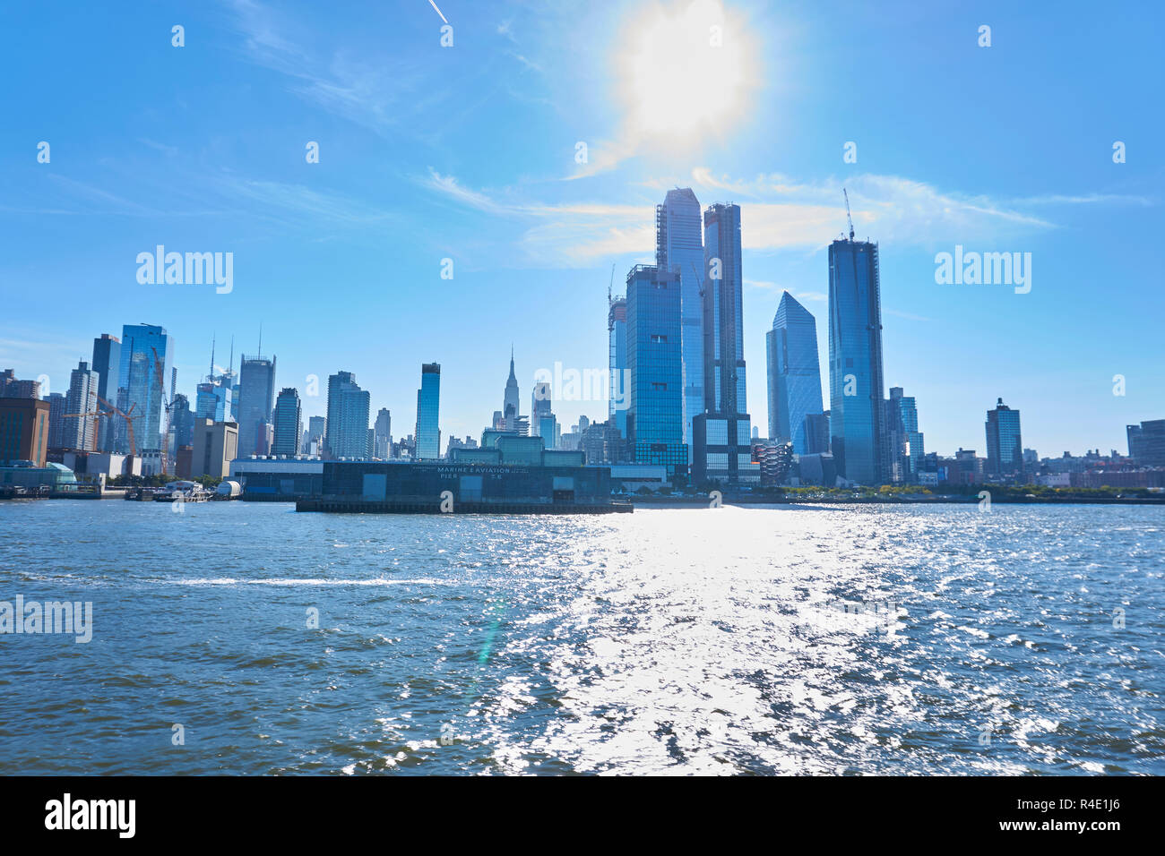 New York City skyline, a blue sky and water Stock Photo - Alamy