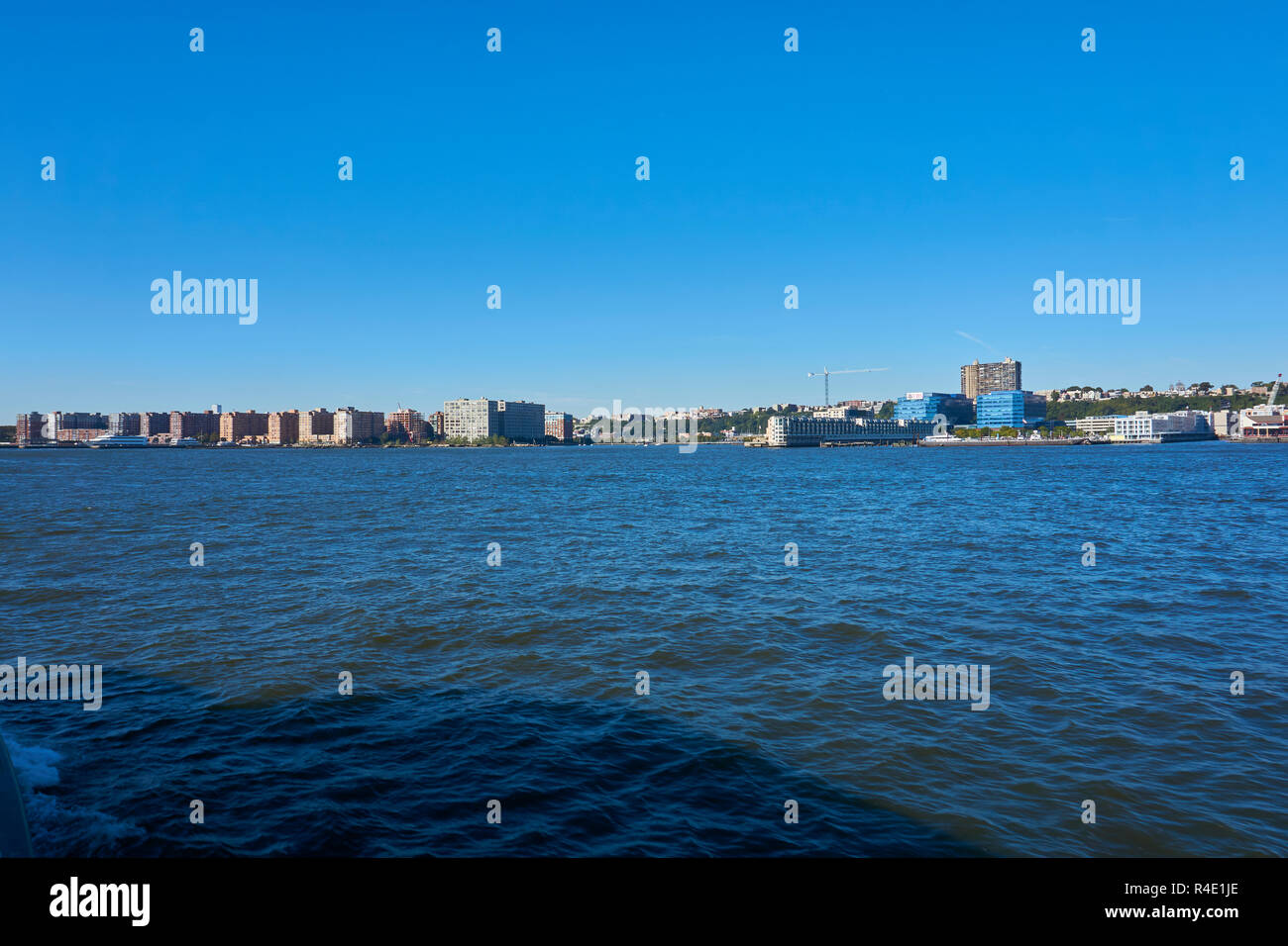 New York City skyline, a blue sky and water Stock Photo