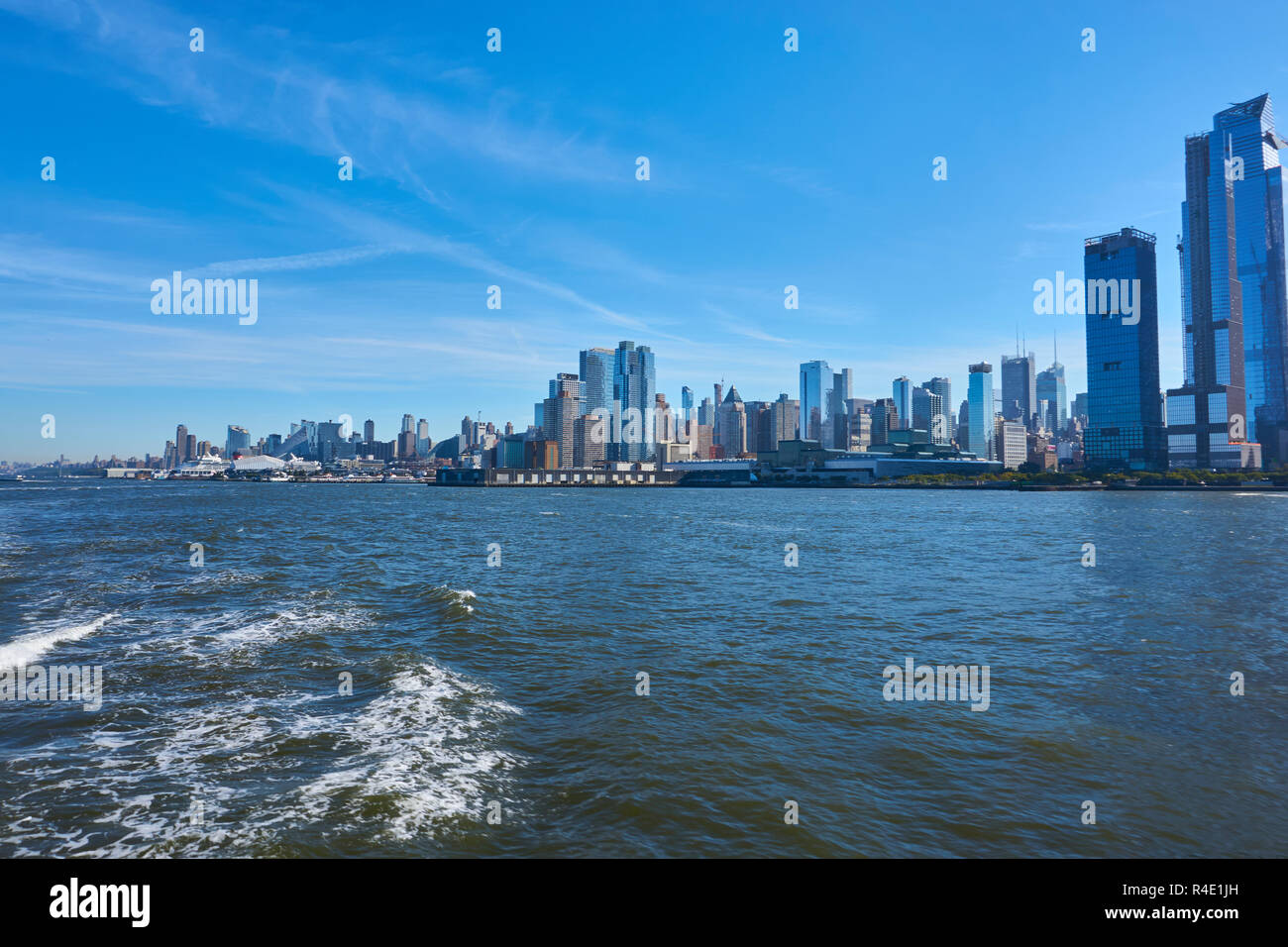 New York City skyline, a blue sky and water Stock Photo - Alamy