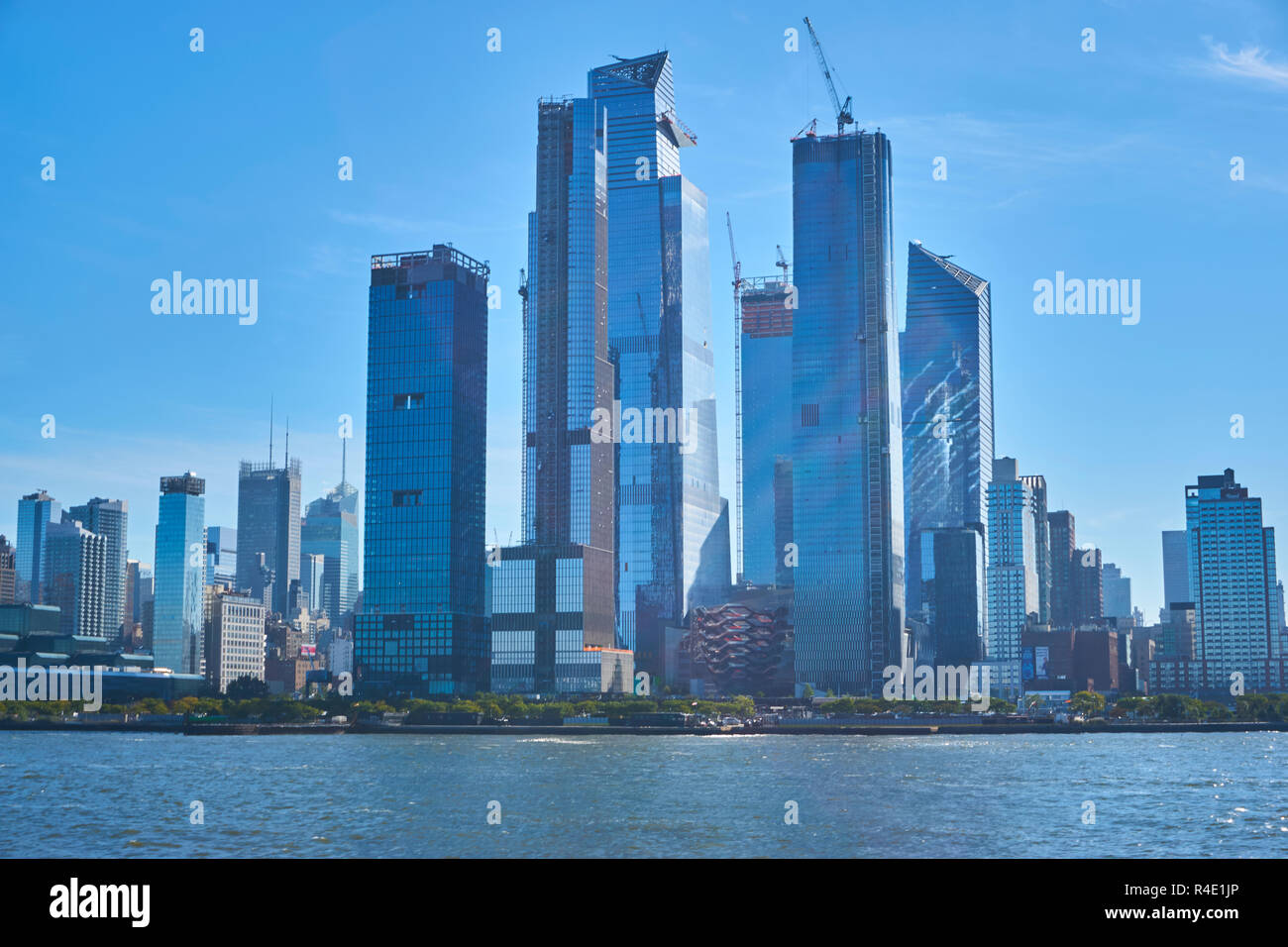 New York City skyline, a blue sky and water Stock Photo - Alamy