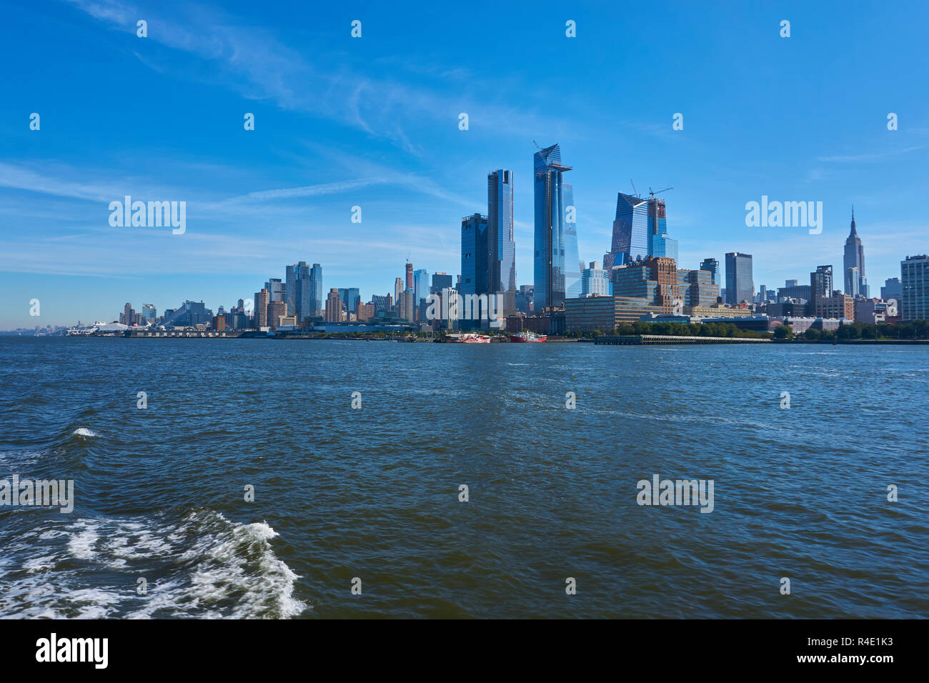 New York City skyline, a blue sky and water Stock Photo - Alamy