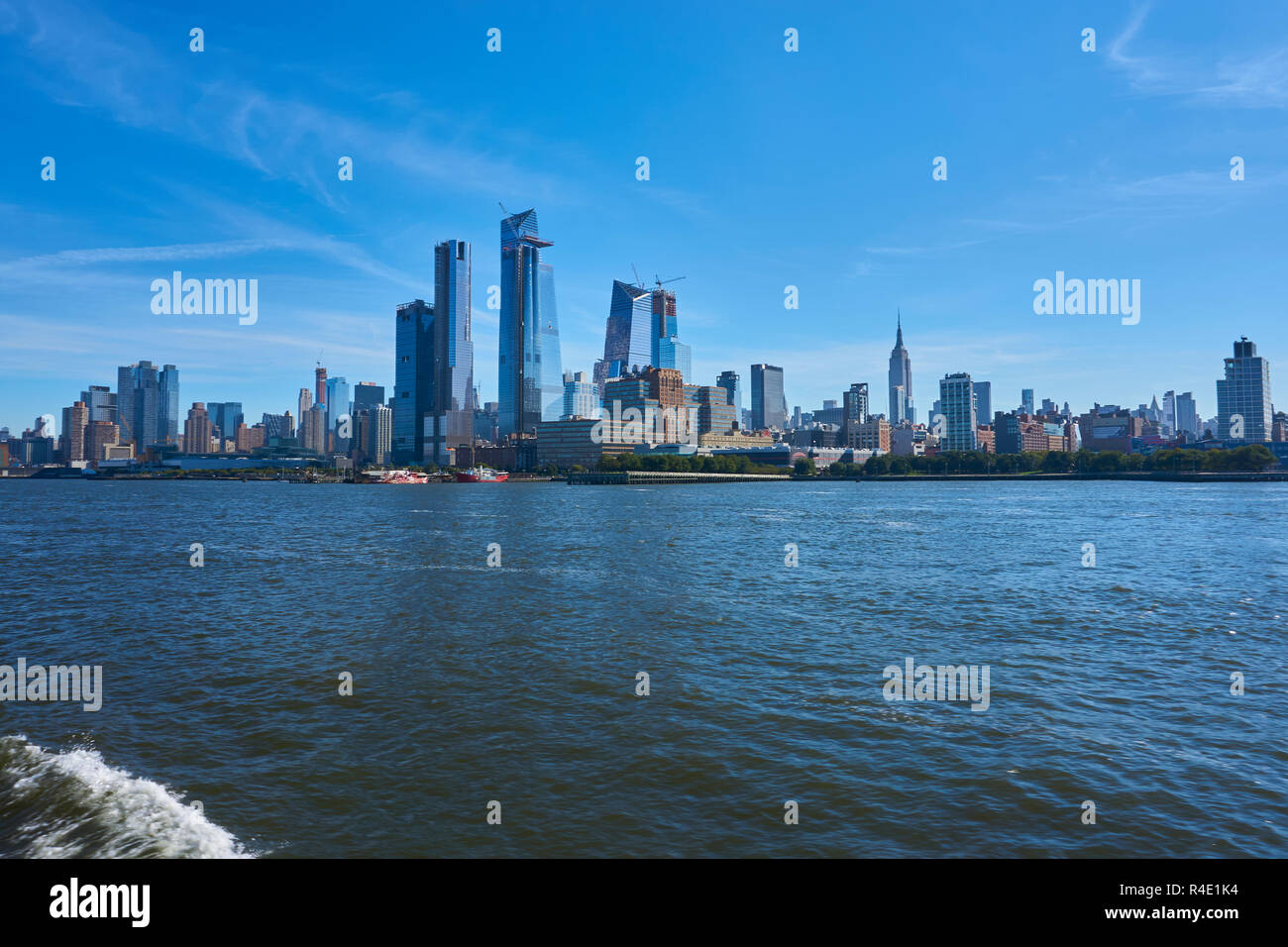 New York City skyline, a blue sky and water Stock Photo - Alamy