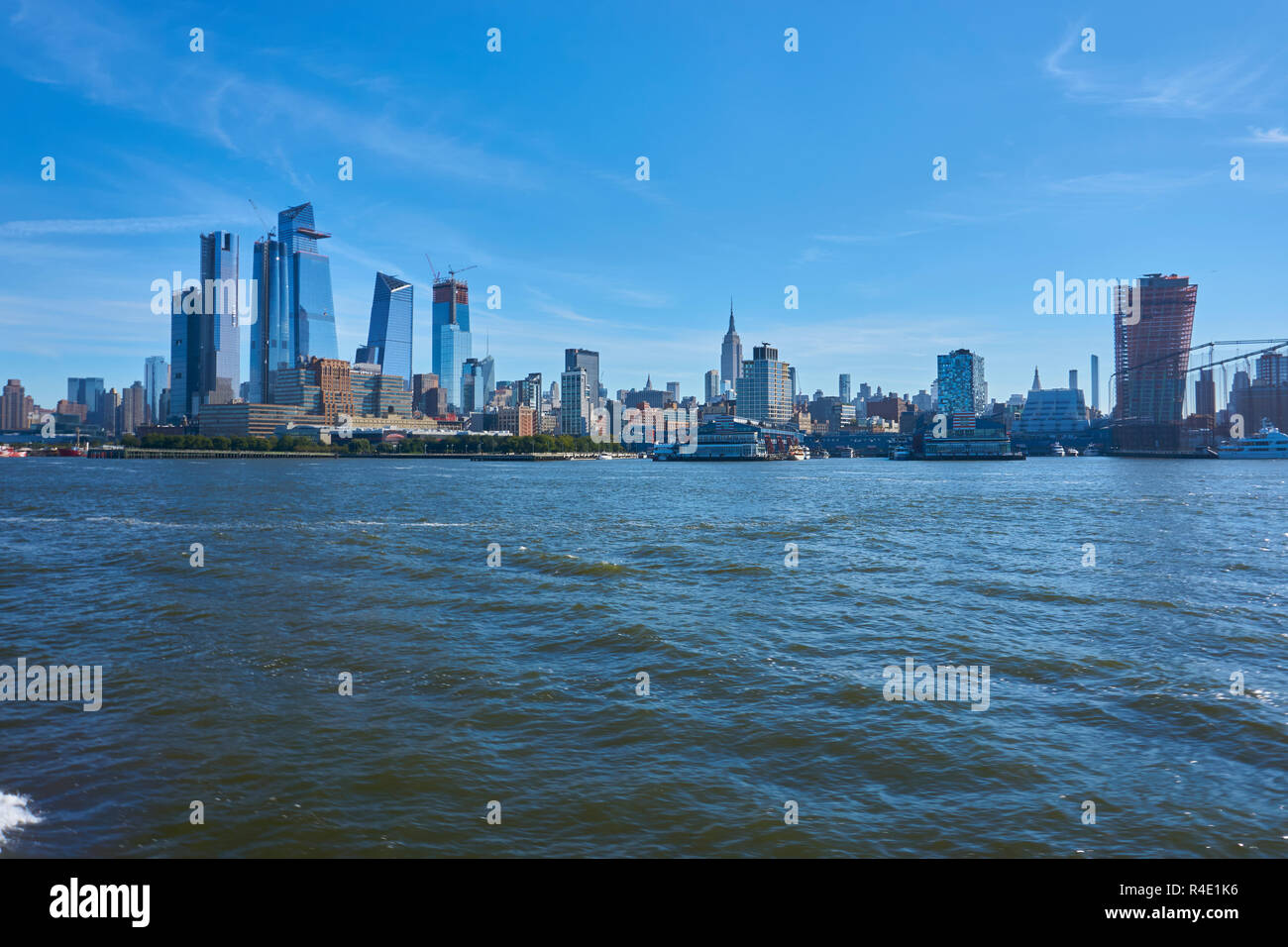 New York City skyline, a blue sky and water Stock Photo - Alamy