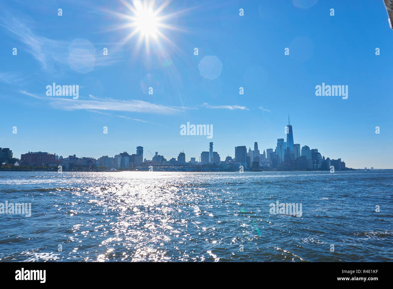 New York City skyline, a blue sky and water Stock Photo - Alamy