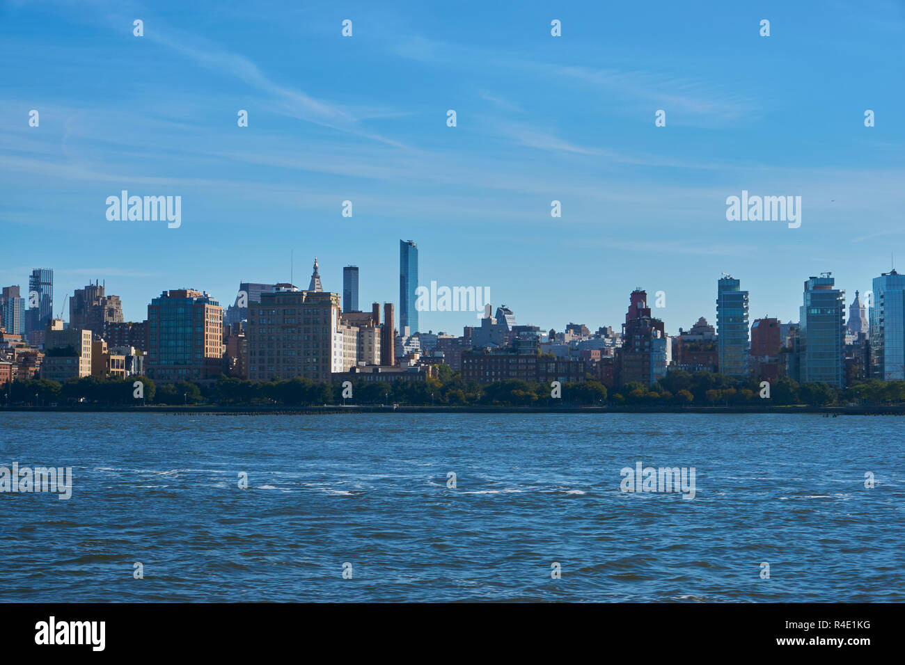 New York City skyline, a blue sky and water Stock Photo - Alamy