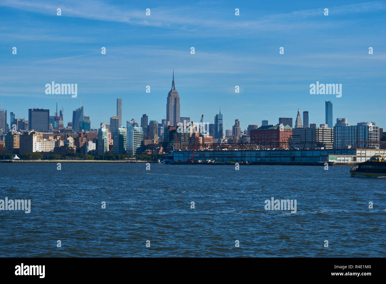 New York City skyline, a blue sky and water Stock Photo - Alamy