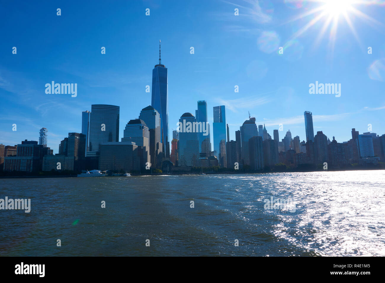 New York City skyline, a blue sky and water Stock Photo - Alamy